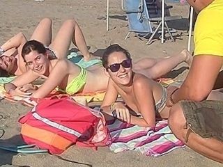 Spanish chicks seduced on a beach